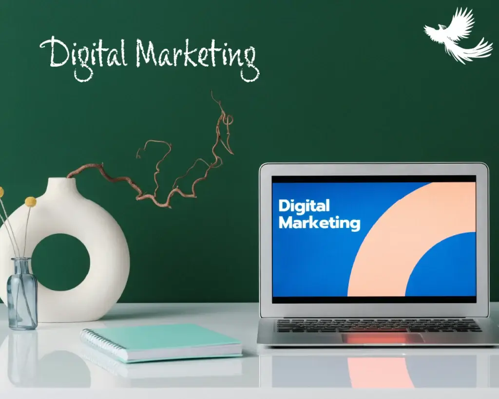 a green screen that look like a teaching board with digital marketing chalk writing and a laptop in front of it on a table with digital marketing writing on a slide showing